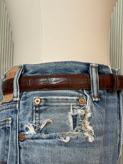 Brown leather belt with silver buckle