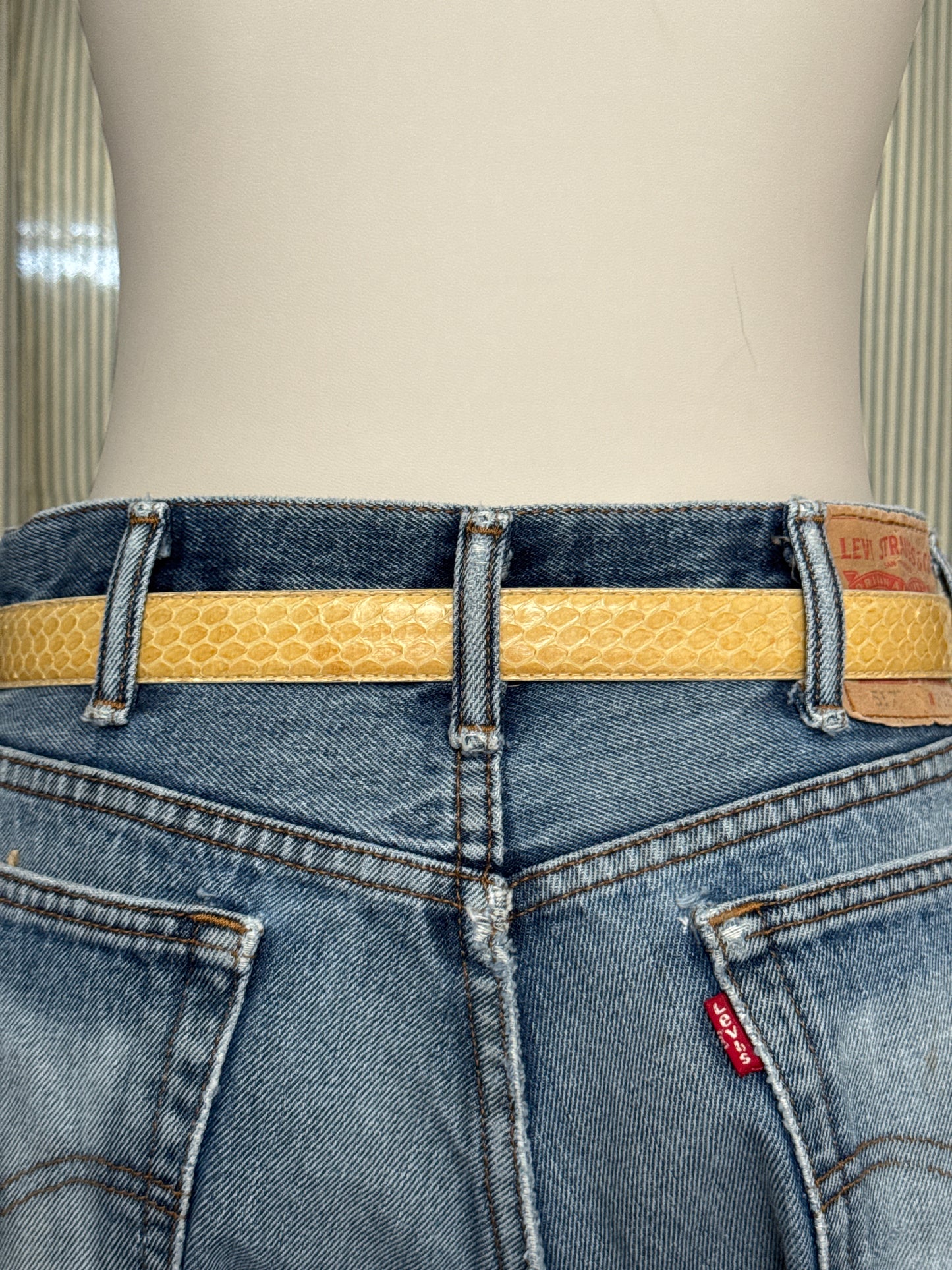 Tan snake skin with gold buckle